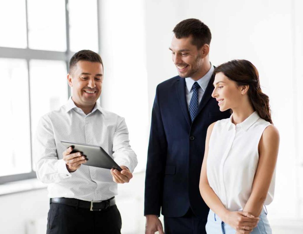 Man showing his tablet to a client
